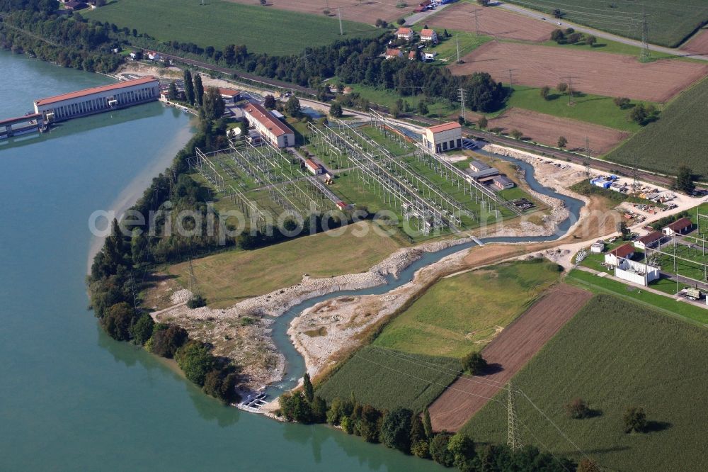 Schwörstadt from the bird's eye view: The water power plant in Schwoerstadt in the state of Baden-Wuerttemberg at the Rhine river with its bypass channel used as fishway. The 1150 meter long fish ladder climbs a height of 9.5 meters between the lower and upper water at the dam