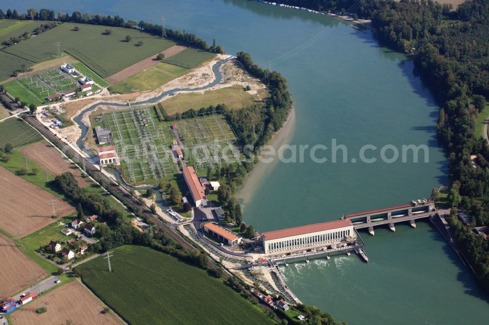 Aerial image Schwörstadt - The water power plant in Schwoerstadt in the state of Baden-Wuerttemberg at the Rhine river with its bypass channel used as fishway. The 1150 meter long fish ladder climbs a height of 9.5 meters between the lower and upper water at the dam