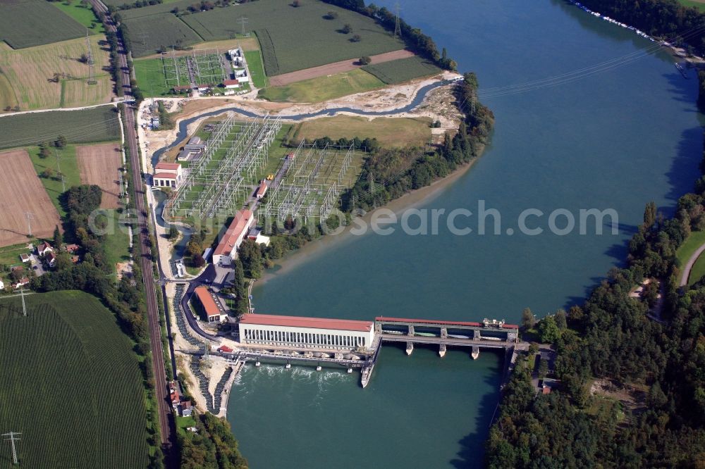 Aerial photograph Schwörstadt - The water power plant in Schwoerstadt in the state of Baden-Wuerttemberg at the Rhine river with its bypass channel used as fishway. The 1150 meter long fish ladder climbs a height of 9.5 meters between the lower and upper water at the dam