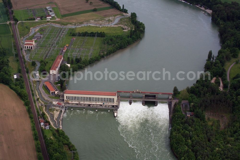 Schwörstadt from above - The water power plant in Schwoerstadt in the state of Baden-Wuerttemberg at the Rhine river with its bypass channel used as fishway. The 1150 meter long fish ladder climbs a height of 9.5 meters between the lower and upper water at the dam