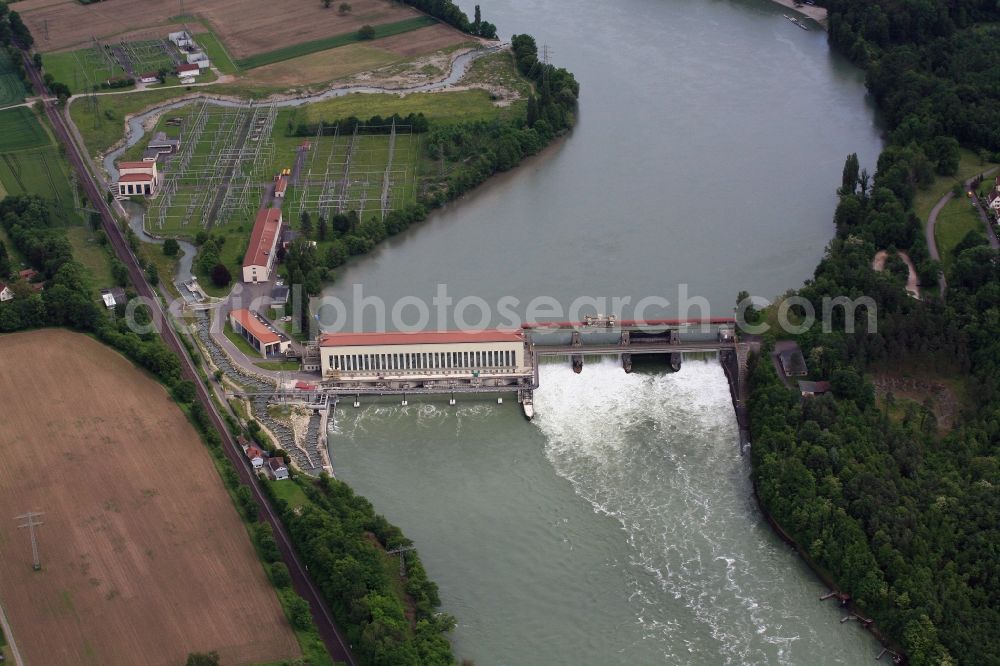 Schwörstadt from the bird's eye view: The water power plant in Schwoerstadt in the state of Baden-Wuerttemberg at the Rhine river with its bypass channel used as fishway. The 1150 meter long fish ladder climbs a height of 9.5 meters between the lower and upper water at the dam