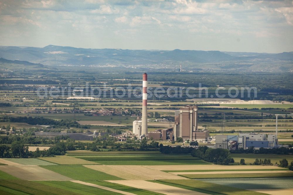 Dürnrohr from above - Power plants and exhaust towers of the thermal power station in Duernrohr in Lower Austria, Austria. The power station is steam powerd and a thermic waste management site, surrounded by agricultural fields