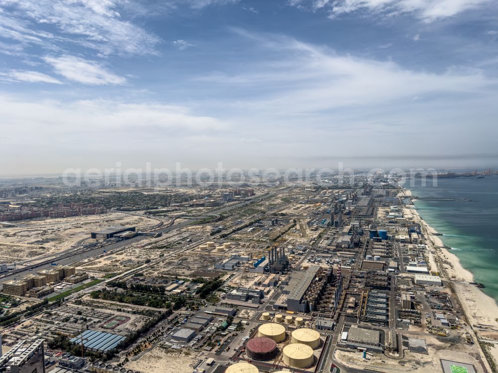 Dubai from the bird's eye view: Power plants and exhaust towers of thermal power station Jebel Ali Power Plant & Desalination Complex on street Unnamed Road in Dubai in United Arab Emirates