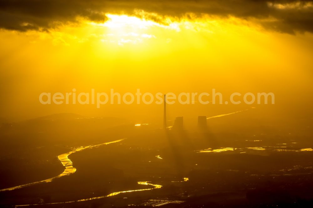 Bergkamen from the bird's eye view: Power plants and exhaust towers of the coal thermal power plant of STEAG coal power plant against the light at sunset on the cloudy horizon in Bergkamen in North Rhine-Westphalia