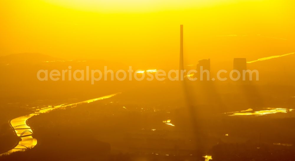 Aerial image Bergkamen - Power plants and exhaust towers of the coal thermal power plant of STEAG coal power plant against the light at sunset on the cloudy horizon in Bergkamen in North Rhine-Westphalia