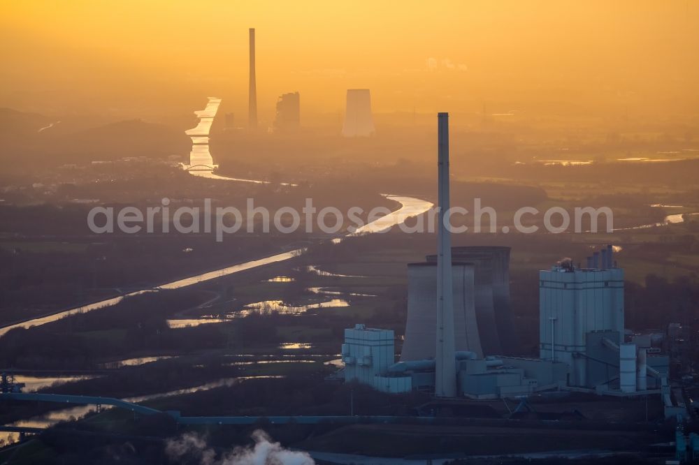 Aerial image Werne - Power plants and exhaust towers of coal thermal power station Gersteinwerk of RWE Power in Werne in the state of North Rhine-Westphalia. The STEAG power plant of Bergkamen is visible in sunset in the background