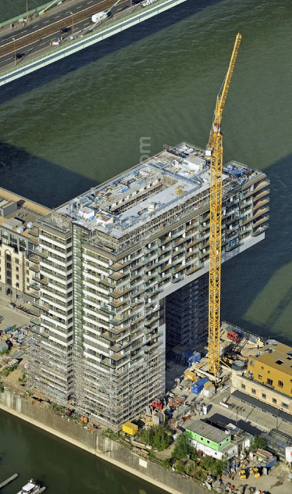 Aerial image Köln - Blick auf die Baustelle der Kranhäuser am Kölner Rheinauhafen. Die Bürogebäude sind alle ca. 60 Meter hoch, 34 Meter breit und haben eine Länge von 70 Metern. Entworfen wurden sie vom Architekturbüro BRT Bothe Richter Teherani. View of the construction site of the Kran Houses on Rheinauhafen. The office buildings are all about 60 feet high, 34 meters wide and have a length of 70 meters. They were designed by architects BRT Bothe Richter Teherani.