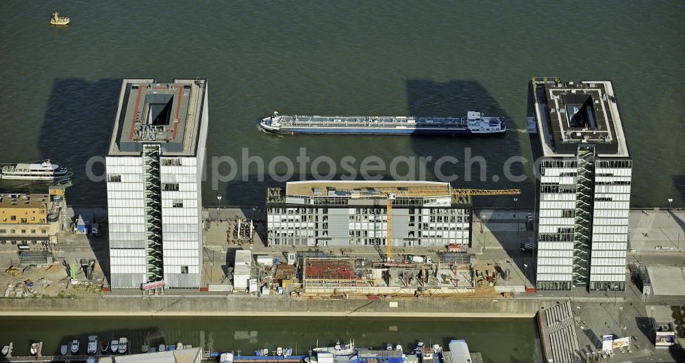 Köln from above - Blick auf die Baustelle der Kranhäuser am Kölner Rheinauhafen. Die Bürogebäude sind alle ca. 60 Meter hoch, 34 Meter breit und haben eine Länge von 70 Metern. Entworfen wurden sie vom Architekturbüro BRT Bothe Richter Teherani. View of the construction site of the Kran Houses on Rheinauhafen. The office buildings are all about 60 feet high, 34 meters wide and have a length of 70 meters. They were designed by architects BRT Bothe Richter Teherani.