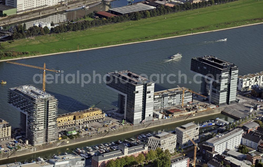 Aerial image Köln - Blick auf die Baustelle der Kranhäuser am Kölner Rheinauhafen. Die Bürogebäude sind alle ca. 60 Meter hoch, 34 Meter breit und haben eine Länge von 70 Metern. Entworfen wurden sie vom Architekturbüro BRT Bothe Richter Teherani. View of the construction site of the Kran Houses on Rheinauhafen. The office buildings are all about 60 feet high, 34 meters wide and have a length of 70 meters. They were designed by architects BRT Bothe Richter Teherani.