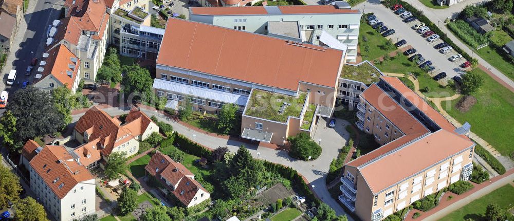 Guben from above - Blick auf das örtliche Krankenhaus Naemi-Wilke-Stift in Guben. 1887 wurde es vom wohlhabenden Hutmacher Friedrich Wilke zur Erinnerung an seine an Typhus verstorbene Tochter als Kinderkrankenhaus gestiftet. View of the local hospital Naomi-Wilke-Stift in Guben. 1887, it was founded as a children hospital by the the wealthy hatter Friedrich Wilke in memory of his deceased daughter who died of typhus.