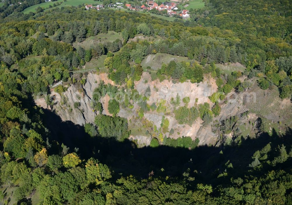 Hammelburg from the bird's eye view: Crater of a disused Quarry for the mining and handling of Basaltstein on Sodenberg in Hammelburg in the state Bavaria