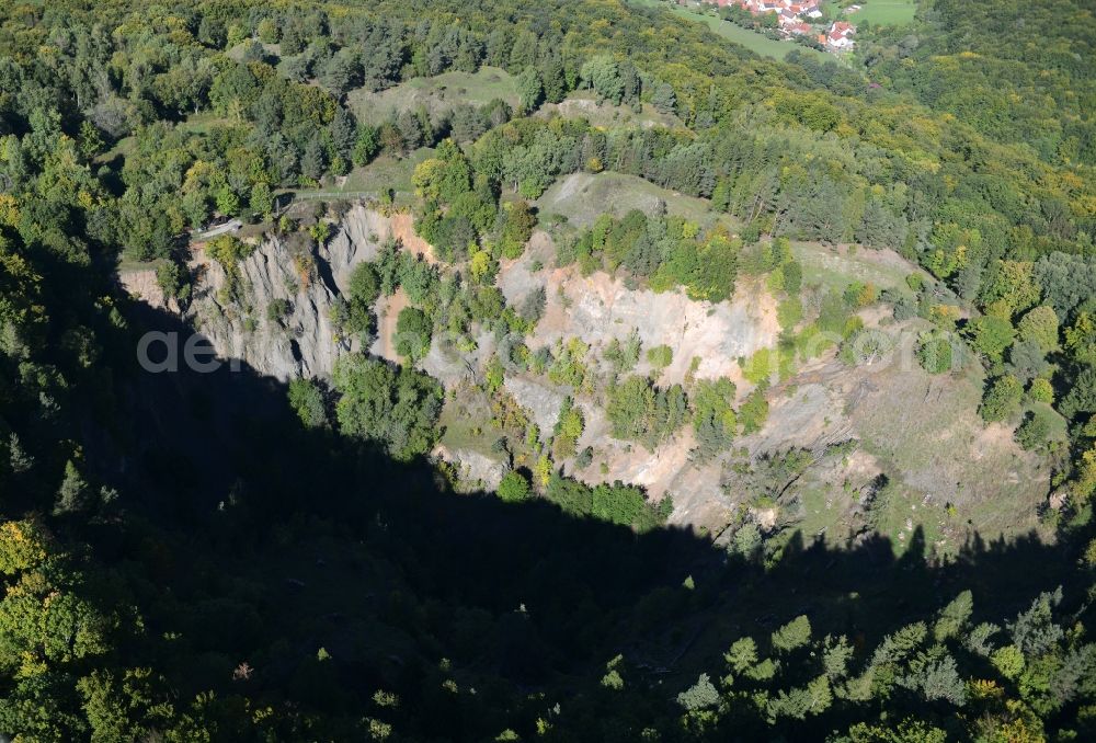 Aerial image Hammelburg - Crater of a disused Quarry for the mining and handling of Basaltstein on Sodenberg in Hammelburg in the state Bavaria