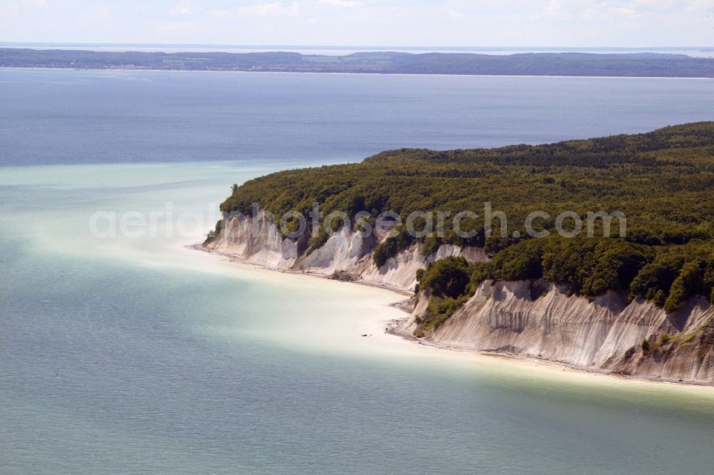 Aerial photograph Sassnitz - The chalk cliffs in Sassnitz in Mecklenburg-Vorpommern belong to the Jasmund National Park on the island of Ruegen. The chalk cliff coast with the Stubbenkammer is a popular destination on the Baltic Sea. The beech forests on the ridge Stubnitz are UNESCO World Heritage Site