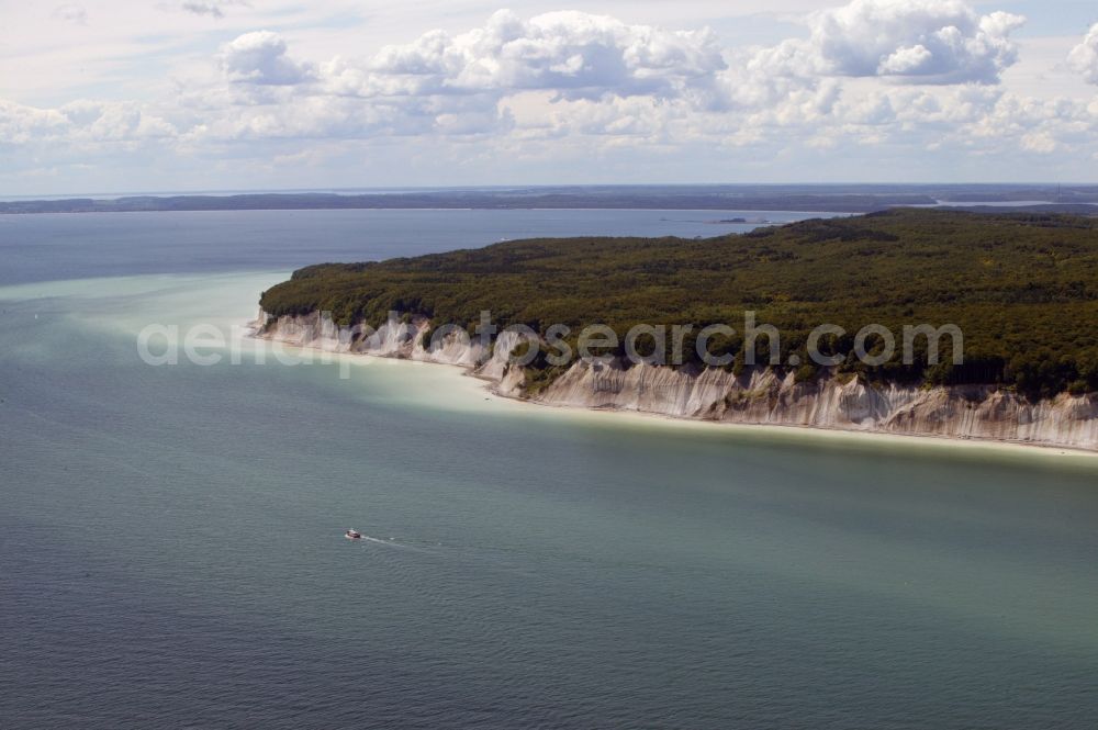 Sassnitz from above - The chalk cliffs in Sassnitz in Mecklenburg-Vorpommern belong to the Jasmund National Park on the island of Ruegen. The chalk cliff coast with the Stubbenkammer is a popular destination on the Baltic Sea. The beech forests on the ridge Stubnitz are UNESCO World Heritage Site