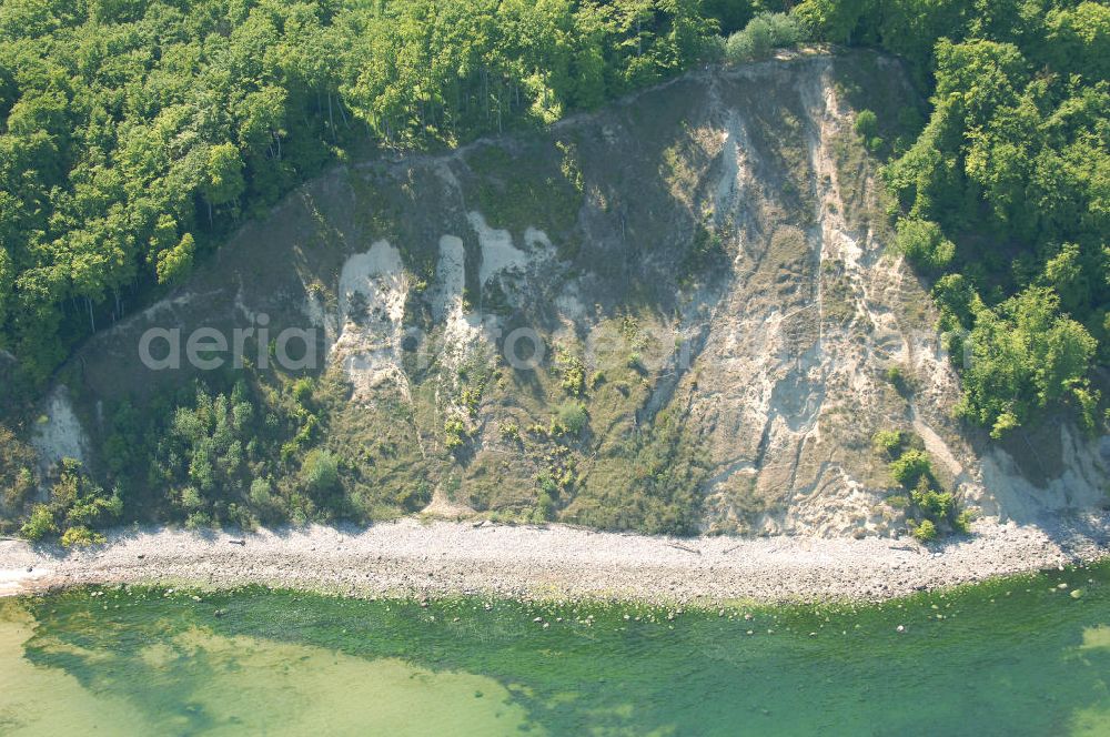 Aerial image Halbinsel Jasmund - Blick auf die Kreidefelsen Steilküste. Im Nordosten der Halbinsel Jasmund auf Rügen erstreckt sich auf rund fünfzehn Kilometer Länge zwischen Sassnitz und Lohme die Kreidefelsen-Steilküste. Teilweise bis 120 Meter ragen die Kreidefelsen empor. Der bekannteste und meistbesuchteste unter ist ein Felsvorsprung mit dem Namen Königsstuhl, der sich etwa 10 km von Sassnitz entfernt befindet.