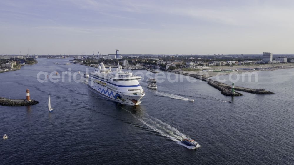 Aerial image Rostock - Cruise and passenger ship AidaAura in mission of baltic sea in the district Warnemuende in Rostock at the baltic sea coast in the state Mecklenburg - Western Pomerania, Germany