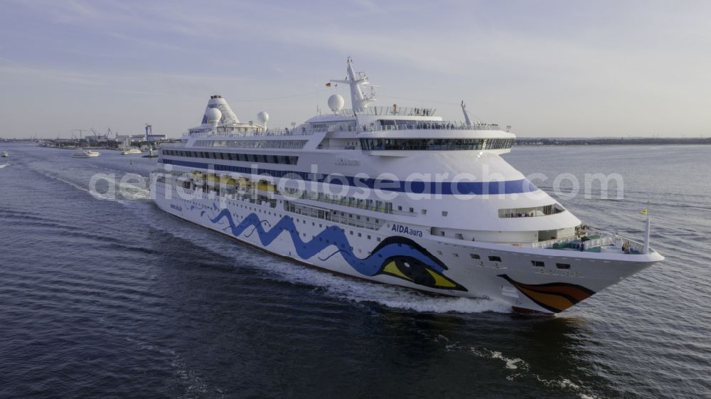 Rostock from the bird's eye view: Cruise and passenger ship AidaAura in mission of baltic sea in the district Warnemuende in Rostock at the baltic sea coast in the state Mecklenburg - Western Pomerania, Germany