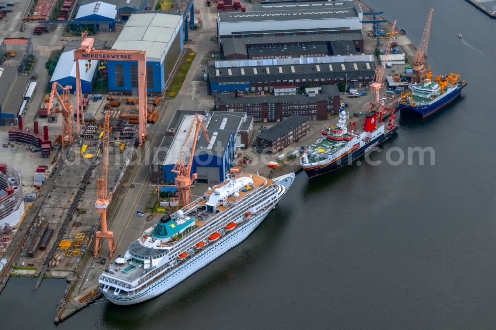 Emden from the bird's eye view: Cruise and passenger ship Amera on dock in Emden in the state Lower Saxony, Germany