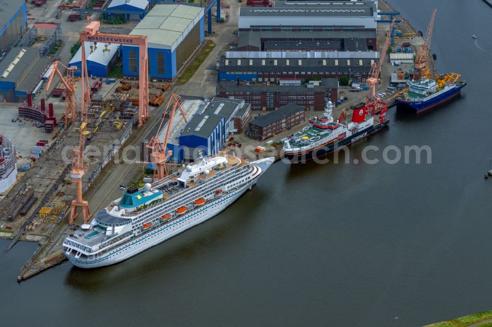 Aerial image Emden - Cruise and passenger ship Amera on dock in Emden in the state Lower Saxony, Germany