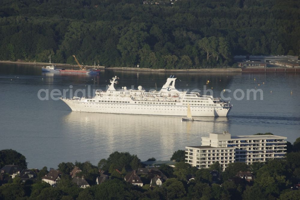 Aerial photograph Kiel - Cruise ship in Kiel on the fjord in Schleswig-Holstein. A ship with an eventful German-German history, which was renamed later in the recognizable here named Astoria. Prior to the Nordic Hotel Astor. IMO No. 8000214