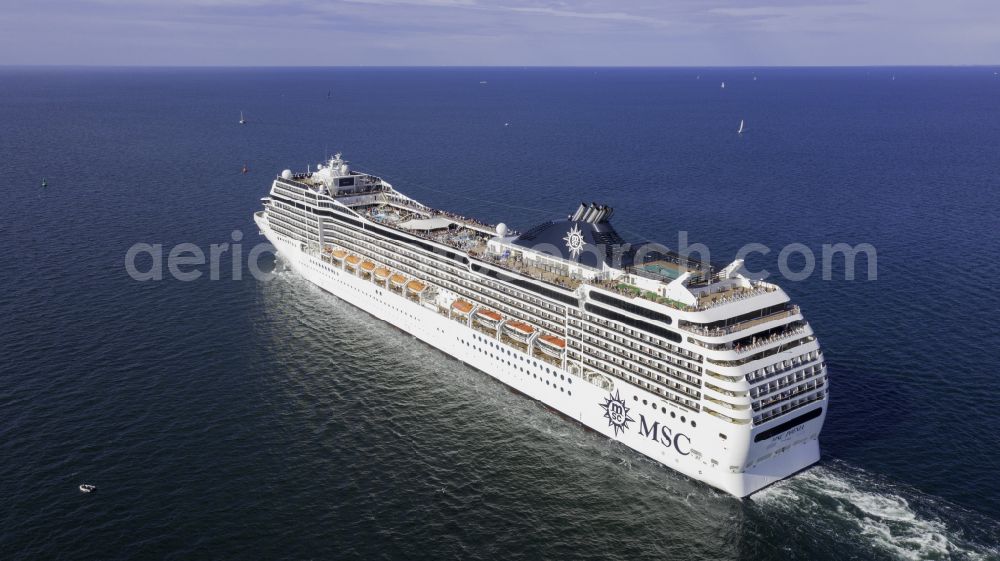 Aerial image Rostock - Cruise and passenger ship MSC Poesia in mission of baltic sea in the district Warnemuende in Rostock at the baltic sea coast in the state Mecklenburg - Western Pomerania, Germany