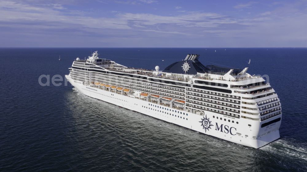 Aerial photograph Rostock - Cruise and passenger ship MSC Poesia in mission of baltic sea in the district Warnemuende in Rostock at the baltic sea coast in the state Mecklenburg - Western Pomerania, Germany