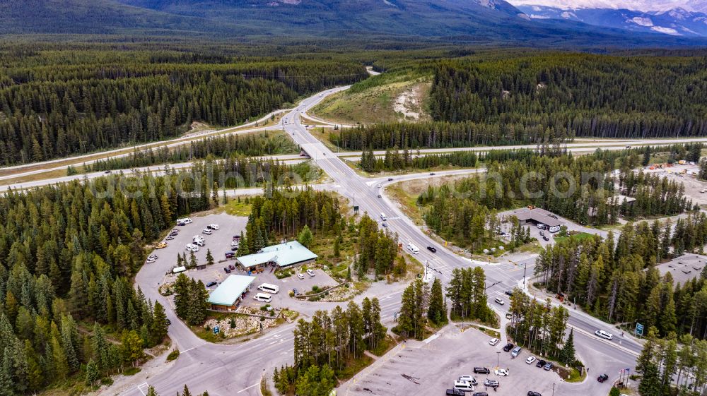 Aerial photograph Lake Louise - Road over the crossroads Trans-Canada Hwy aka Icefields Pkwy on street Bow Valley Parkway in Lake Louise in Alberta, Canada