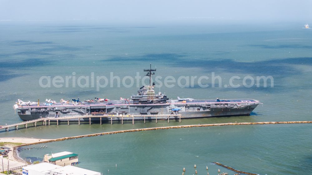 Corpus Christi from the bird's eye view: Ship of the Navy USS Lexington, CV-16, Essex-Class Aircraft Carrier on street North Shoreline Boulevard in Corpus Christi in Texas, United States of America