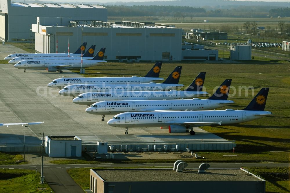 Aerial image Schönefeld - Decommissioned due to crisis passenger airplanes of the airline Lufthansa in parking position - parking area at the airport in Schoenefeld in the state Brandenburg, Germany