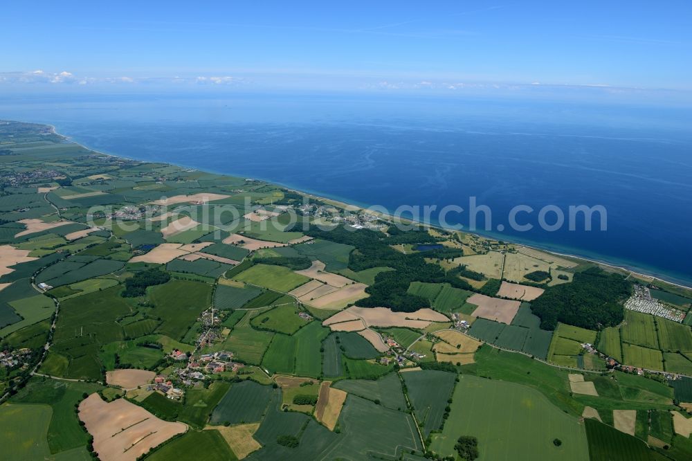 Panker from the bird's eye view: Coastline of the Baltic Sea in Panker with a lot of tended green fields in the state Schleswig-Holstein