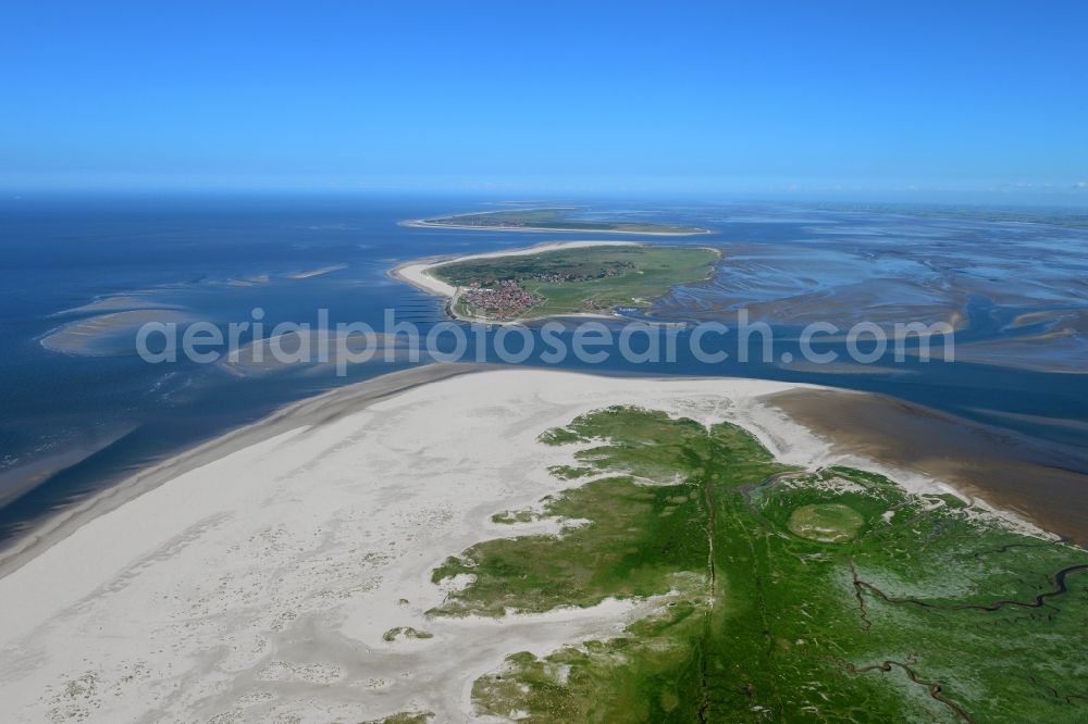 Baltrum from the bird's eye view: Coastline on the sandy beach of North Sea Island Norderney with view to the isalnd of Baltrum in the state Lower Saxony