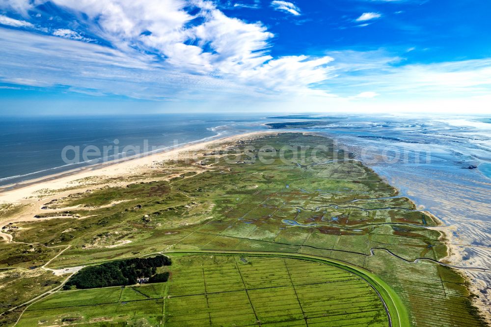 Norderney from above - Coastal landscape on the sandy beach Ostende with the wreck of the former Schillsauger Capella and the Ost Beacon in Norderney in the state of Lower Saxony, Germany