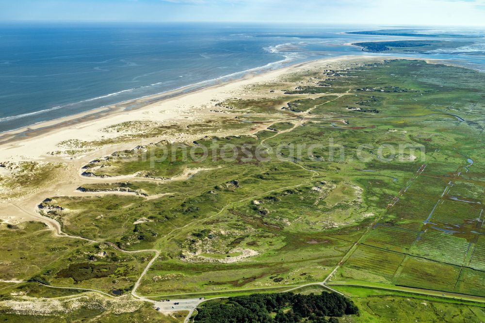 Norderney from the bird's eye view: Coastal landscape on the sandy beach Ostende with the wreck of the former Schillsauger Capella and the Ost Beacon in Norderney in the state of Lower Saxony, Germany