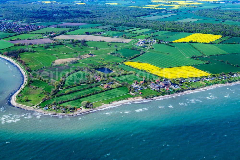 Dahme from above - Coastal landscape on the sandy beach of the Baltic Sea in Dahmeshoeved with the lighthouse in the state of Schleswig-Holstein