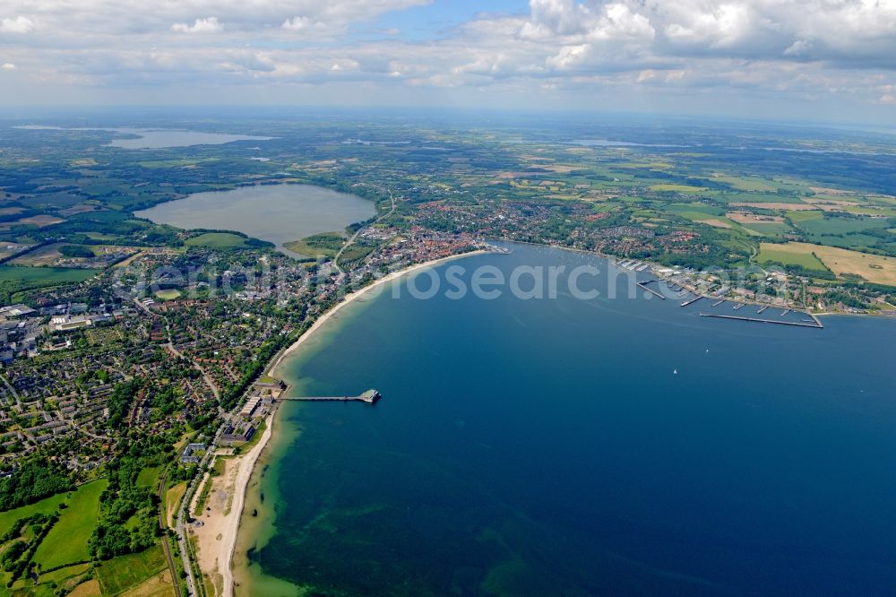 Aerial image Eckernförde - Coastline on the sandy beach of the baltic sea and the city Eckernfoerde with its surroundig lakes, forestland and fields in the state Schleswig-Holstein