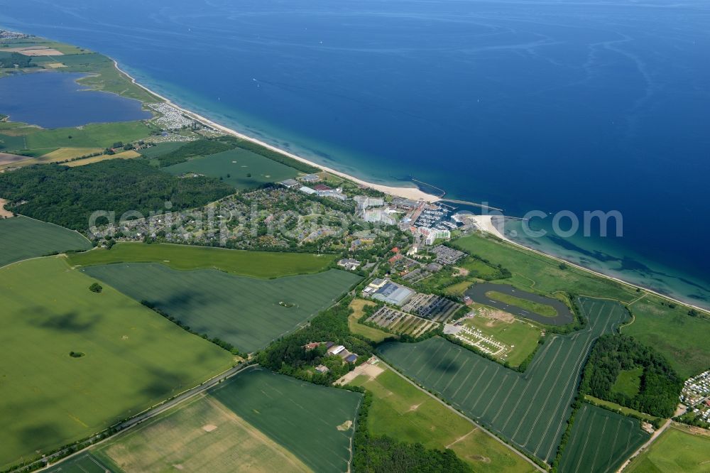 Aerial image Damp - Coastline on the sandy beach of the baltic sea and the local community Damp with fields in the state Schleswig-Holstein