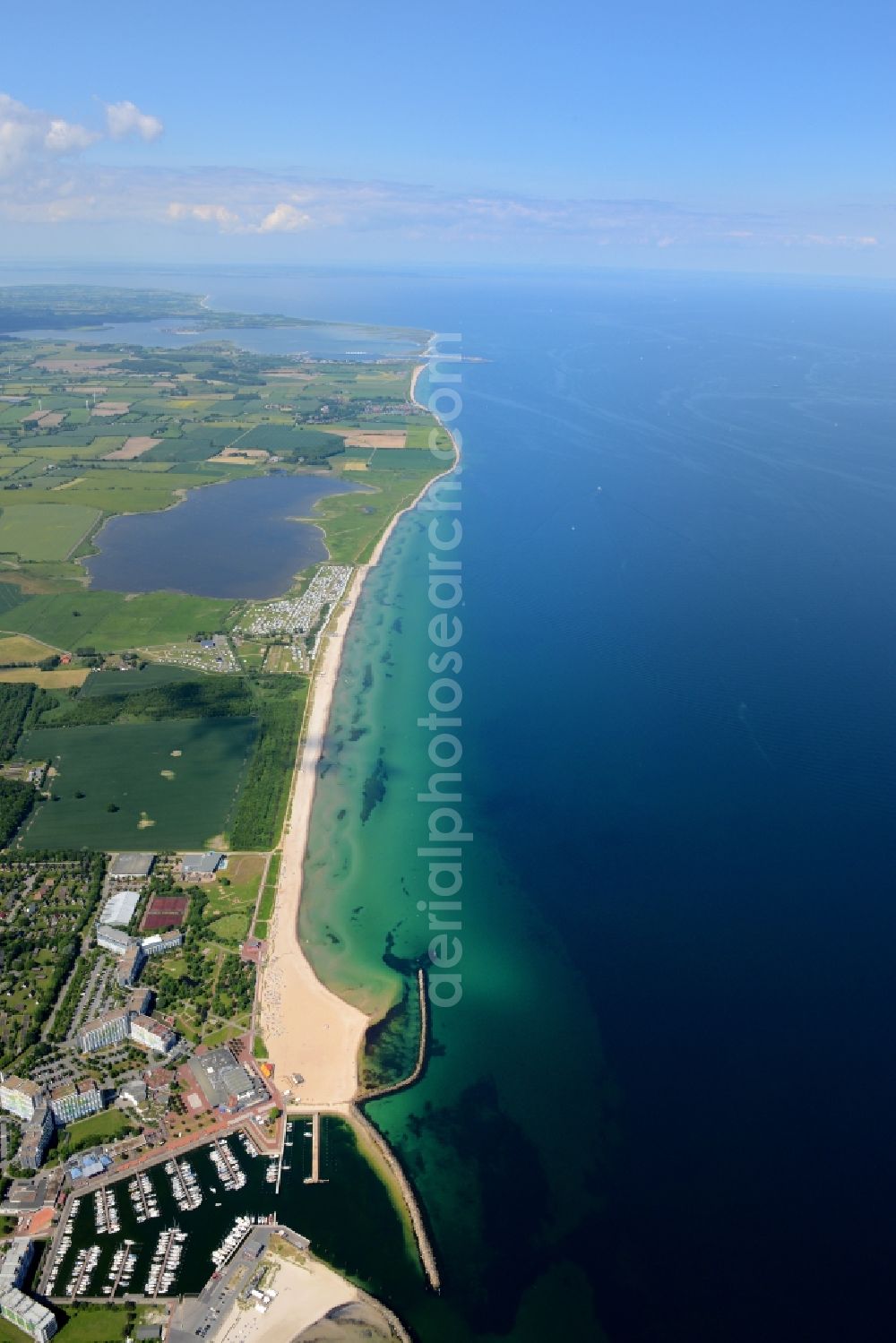 Aerial image Damp - Coastline on the sandy beach of the baltic sea and the local community Damp with fields in the state Schleswig-Holstein