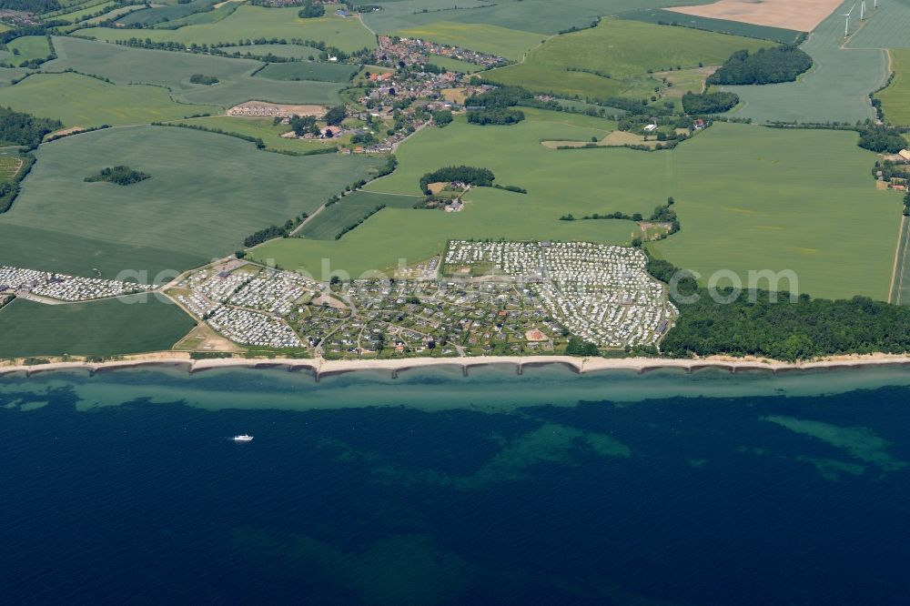 Schashagen from the bird's eye view: Coastline on the sandy beach of the baltic sea and nearby camping areas in Schashagen in the state Schleswig-Holstein