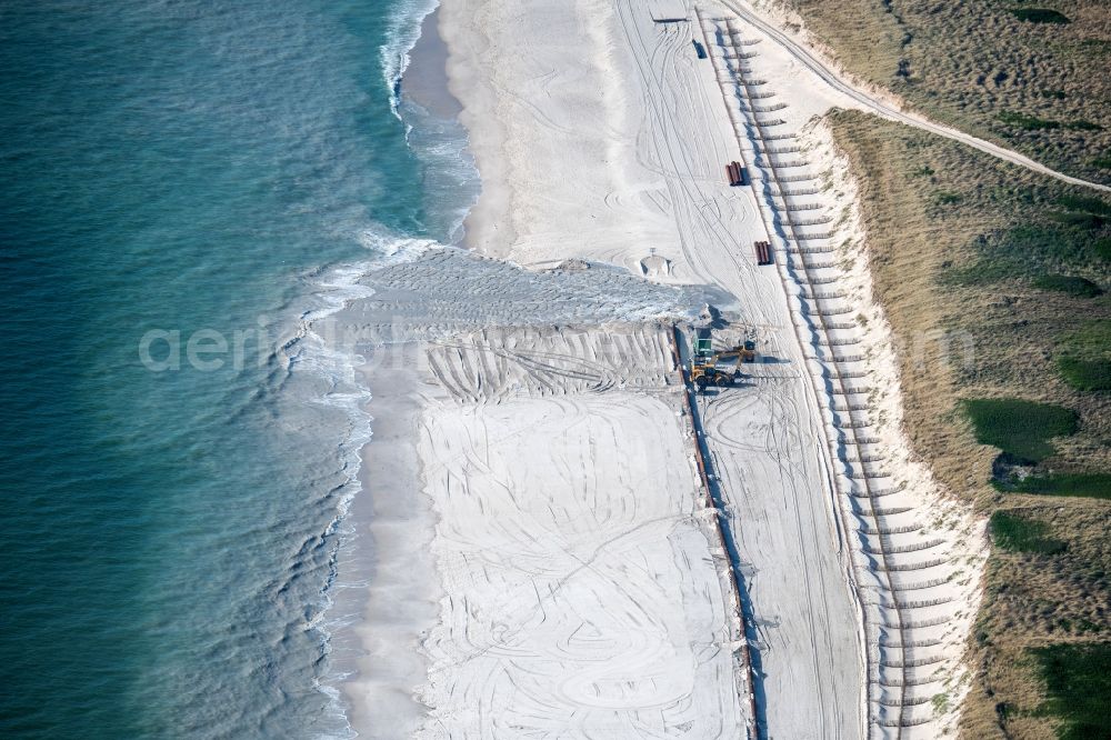 Hörnum (Sylt) from the bird's eye view: Coastal landscape on the sandy beach of the west coast with sand covering for coastal protection in Hoernum (Sylt) in the state Schleswig-Holstein, Germany