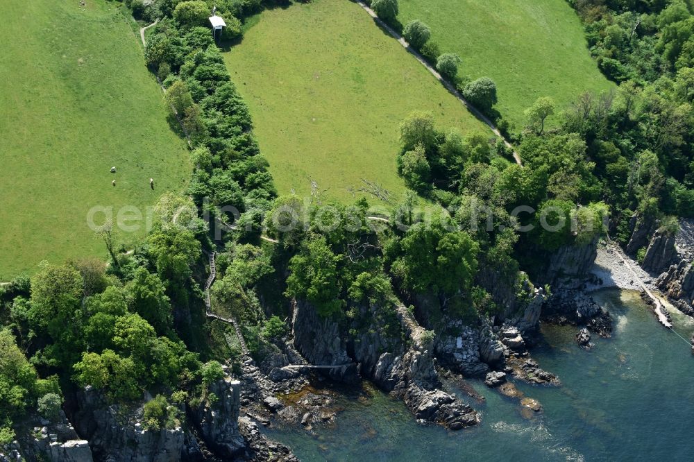 Aerial image Gudhjem - Coastline at the rocky cliffs Helligdomsklipperne of Baltic Sea on Bornholm Island in Gudhjem in Region Hovedstaden, Denmark