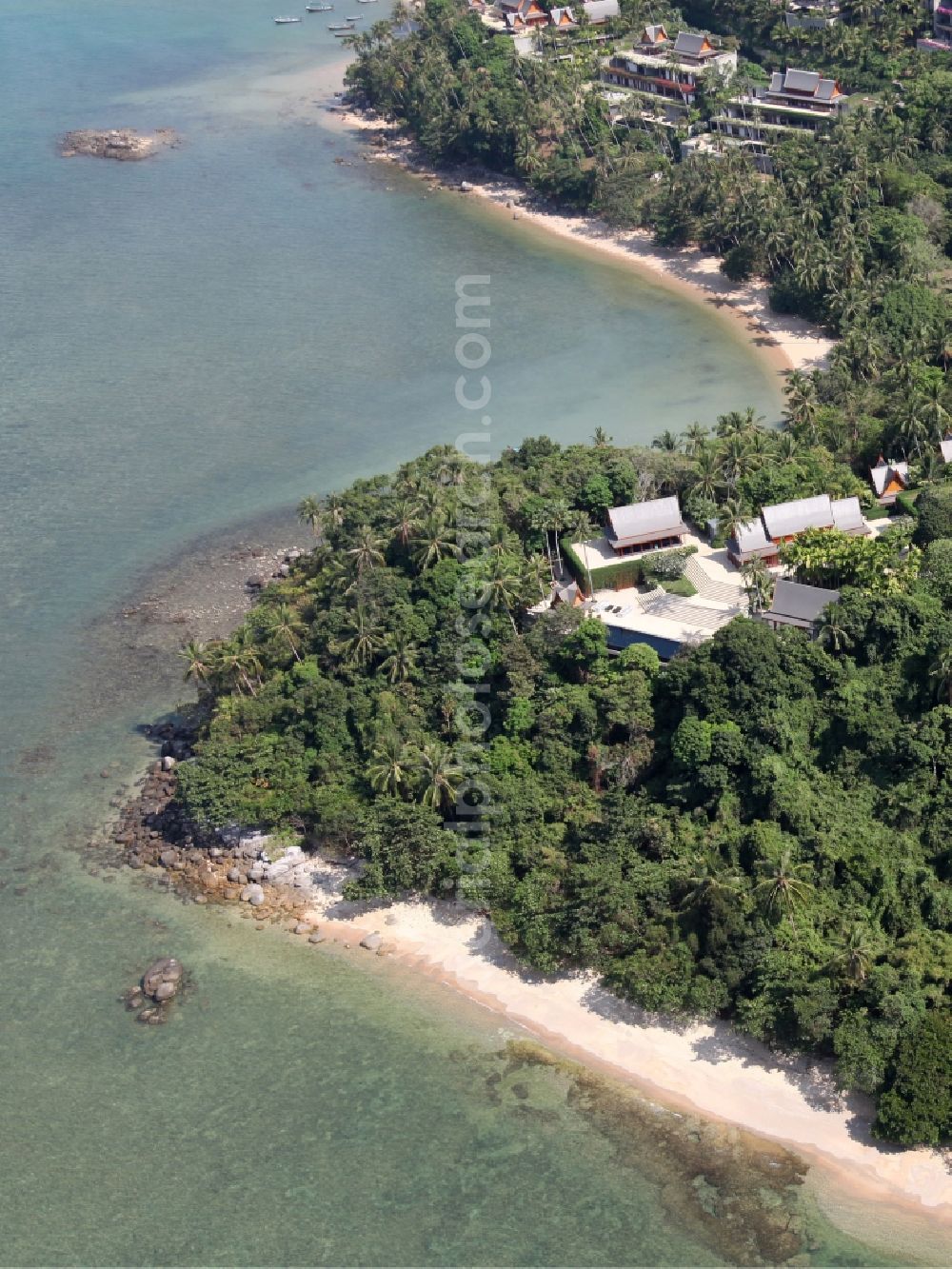 Choeng Thale from the bird's eye view: The coastal area near Choeng Thale on the island of Phuket in Thailand is located in the west of the island and is characterized by palm forests and sandy beaches with rocky sections.