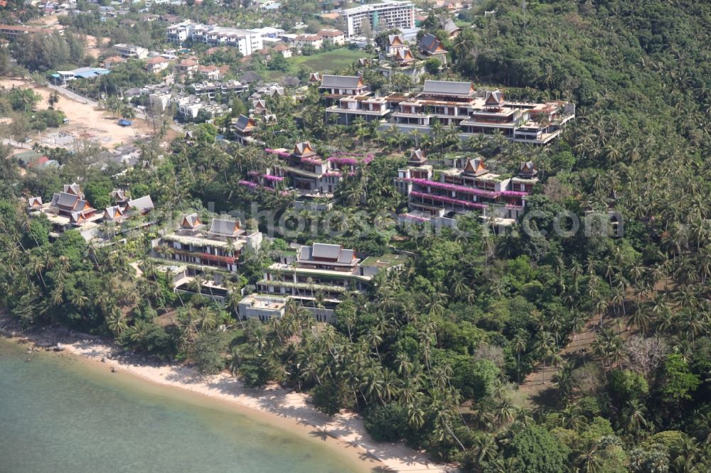 Aerial image Choeng Thale - The coastal area near Choeng Thale on the island of Phuket in Thailand is located in the west of the island and is characterized by palm forests and sandy beaches with rocky sections.