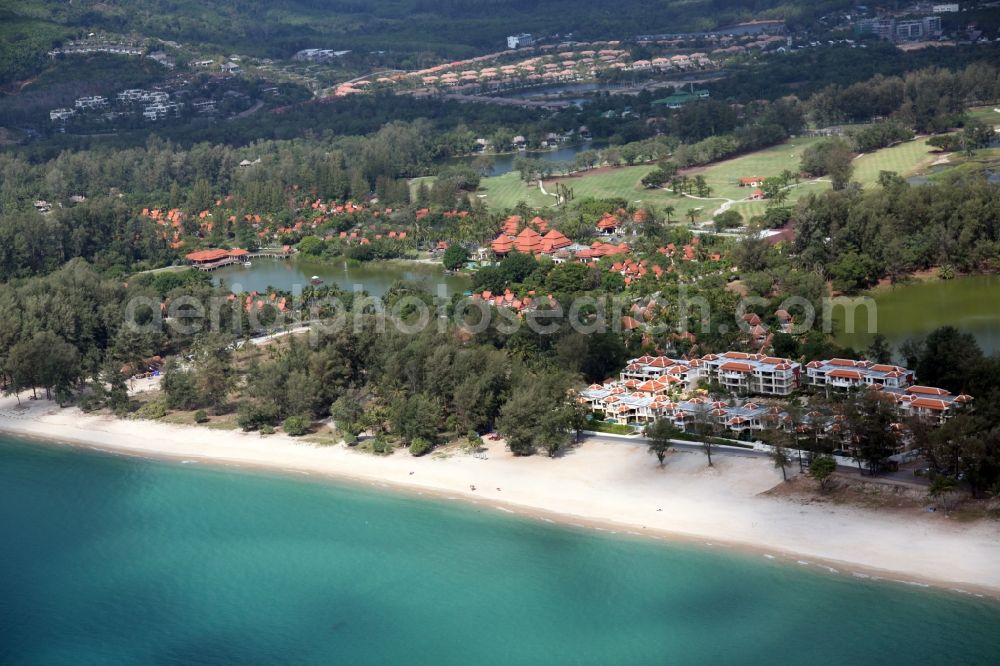 Choeng Thale from the bird's eye view: Coastline with sandy beach, palm trees, luxury hotels and lagoon at Choeng Thale on the island of Phuket in Thailand