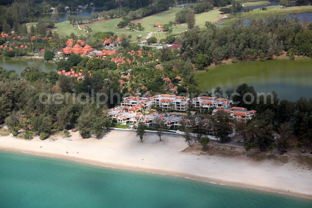 Aerial image Choeng Thale - Coastline with sandy beach, palm trees, luxury hotels and lagoon at Choeng Thale on the island of Phuket in Thailand