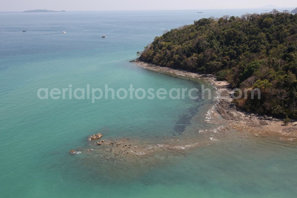 Ratsada from above - Rocky coastline with crystal clear water on the peninsula Laem Tukkae Ratsada on the island of Phuket in Thailand