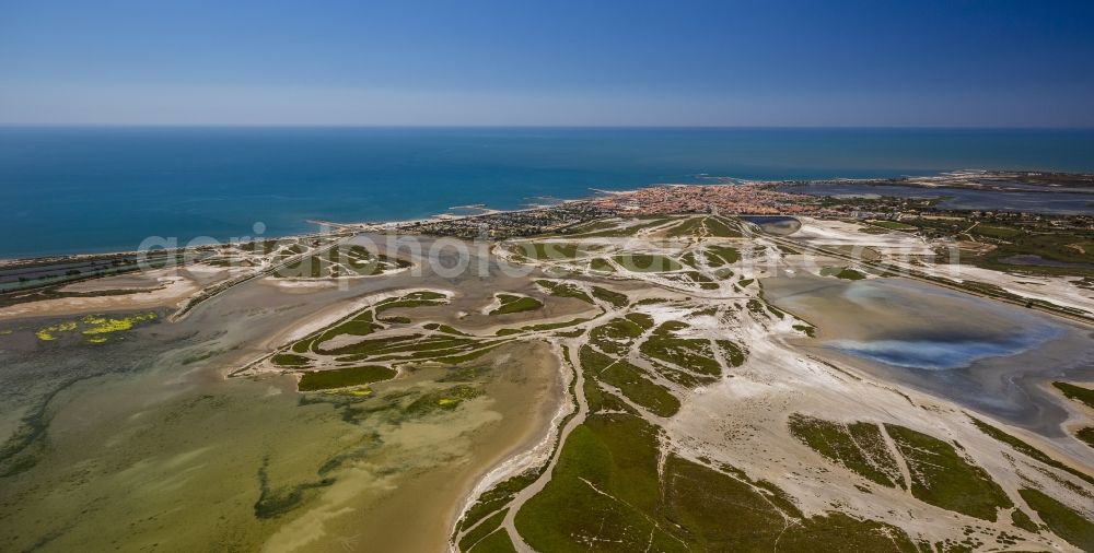 Saintes-Maries-de-la-Mer from the bird's eye view: Coastal dunes and landscape of the Camargue at Saintes-Maries-de-la-Mer, Provence-Alpes-Cote d'Azur in France