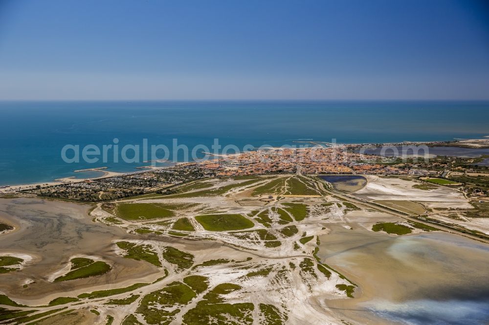 Saintes-Maries-de-la-Mer from above - Coastal dunes and landscape of the Camargue at Saintes-Maries-de-la-Mer, Provence-Alpes-Cote d'Azur in France