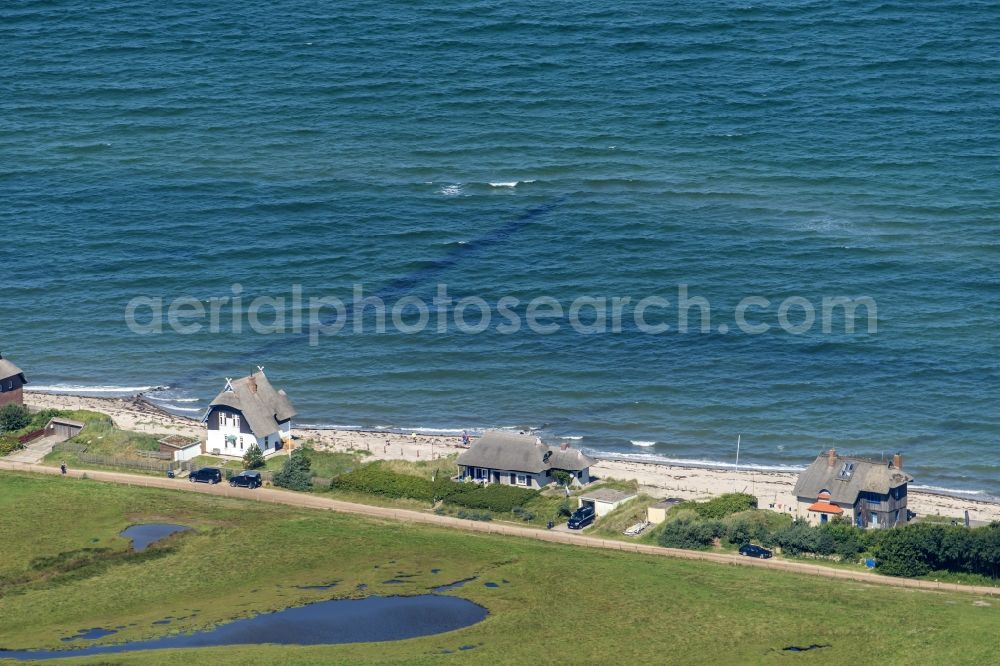 Heiligenhafen from above - Coastal area of the peninsula Graswarder-Heilgenhafen with a few single- family houses at the beach in Grossenbrode in the state Schleswig-Holstein