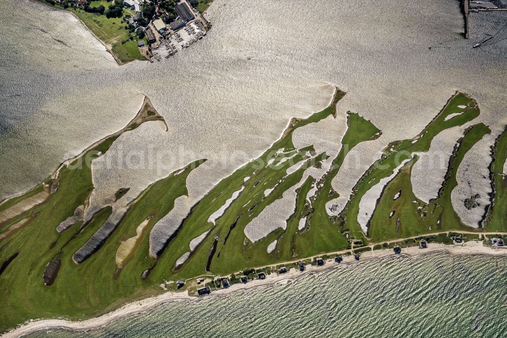 Heiligenhafen from above - Coastal area of the peninsula Graswarder-Heilgenhafen with a few single- family houses at the beach in Grossenbrode in the state Schleswig-Holstein