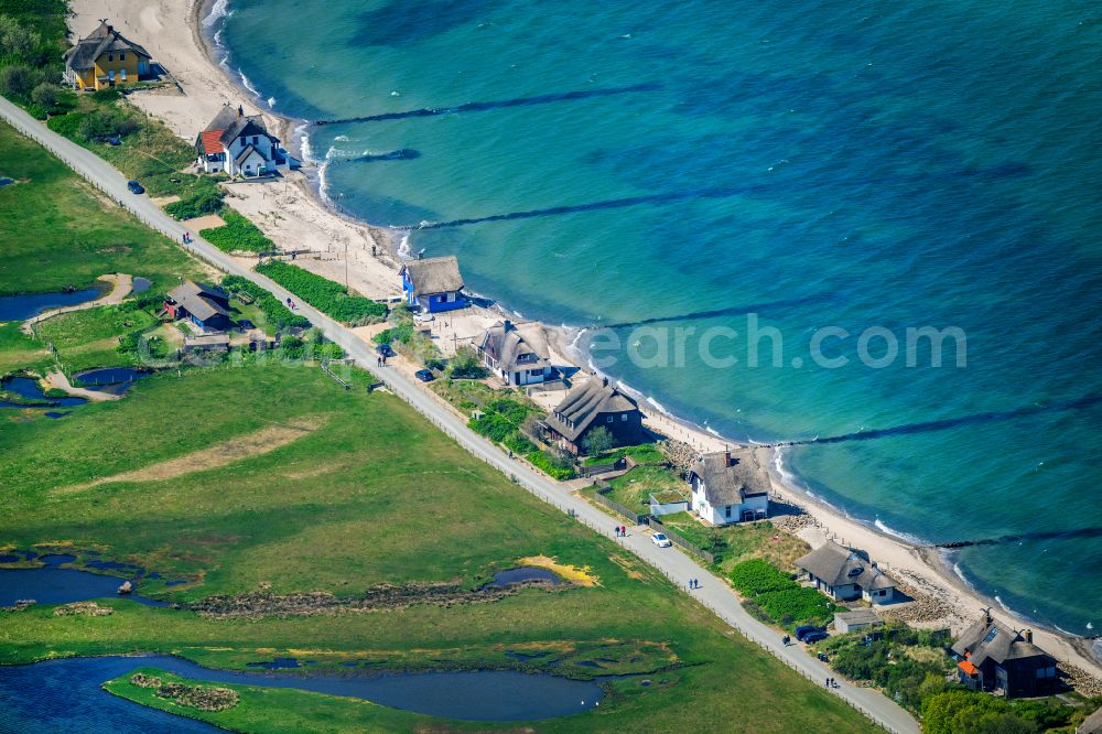 Heiligenhafen from above - Coastal area of the peninsula Graswarder-Heilgenhafen with a few single- family houses at the beach in Grossenbrode in the state Schleswig-Holstein